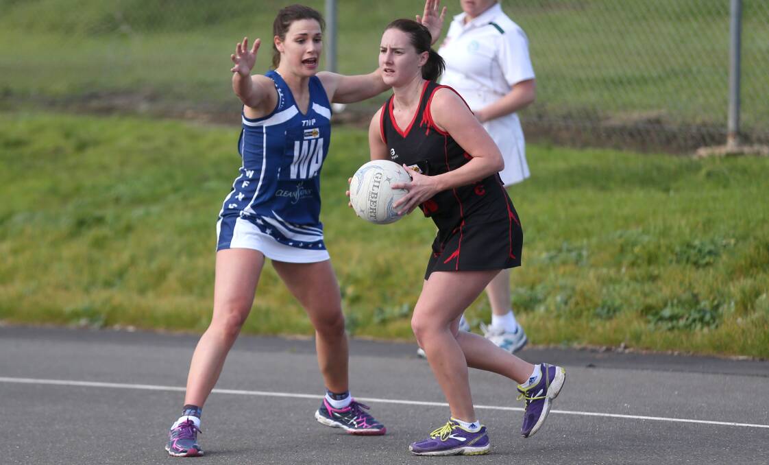 ON GUARD: Cobden wing defence Helene Myers avoids Warrnambool wing attack Anna Buzolich at Reid Oval on Saturday. Picture: Amy Paton