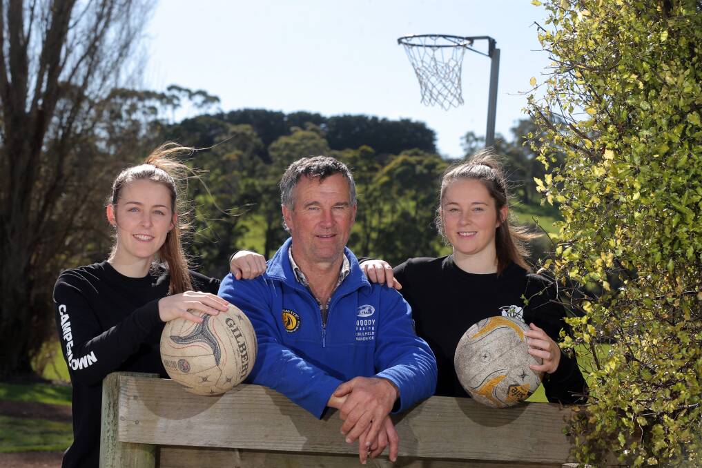 FAMILY TIES: Camperdown netball coach Peter Finch, pictured with daughters Jaymie and Emily, believes the latter is still battling an ankle injury which is hampering her impact on court. Picture: Rob Gunstone