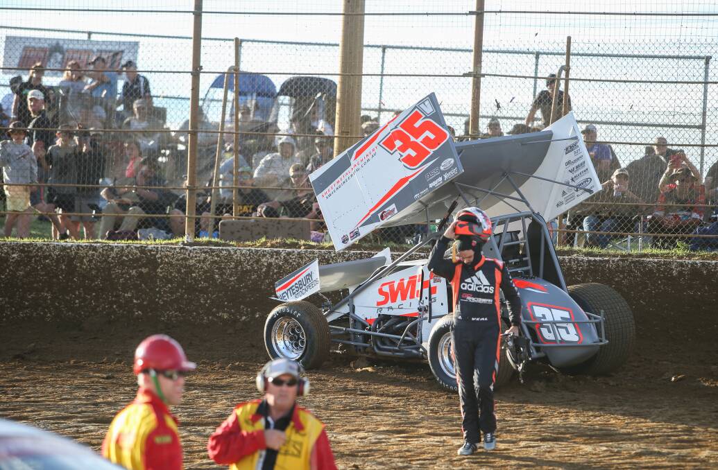 CRASH PAIN: Warrnambool driver Jamie Veal walks away from his car after a crash on turn one of his heat threw his title defence into disarray. Pictures: Amy Paton