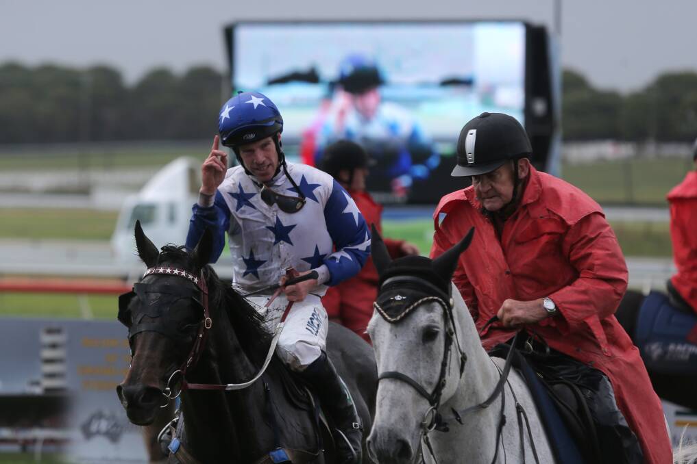 HAPPY HOOP: Jockey John Allen celebrates after leading Paraggi to victory in race two, a 3200-metre maiden hurdle. Picture: Rob Gunstone