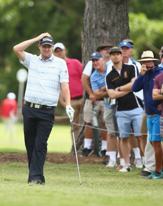 BAFFLED: Warrnambool professional Marc Leishman was left scratching his head after carding a five-over par 76 in the second round of the Australian Open. Picture: Getty Images