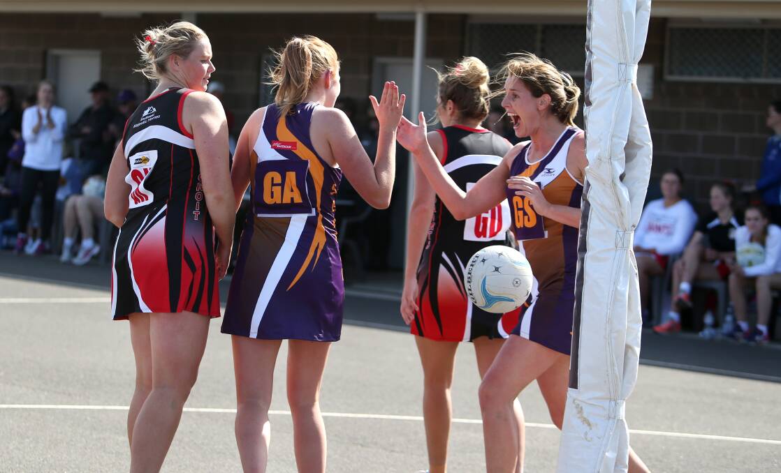 HIGH FIVE: Emily Forrest and Carley Thomas celebrate a preliminary final goal. Picture: Amy Paton
