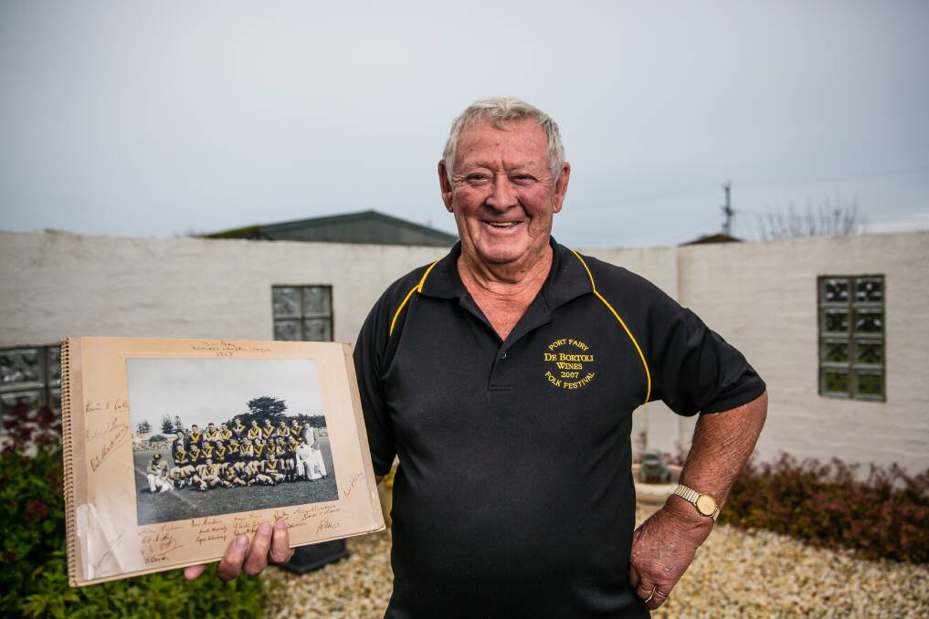 PURPLE PRIDE: Port Fairy premiership player Jimmy Murray has a collection of treasured momentos from the Seagulls' 1958 flag. Pictures: Christine Ansorge
