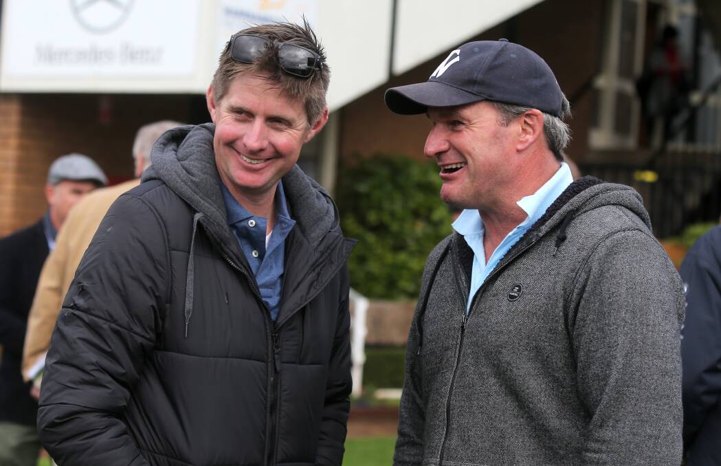 ALL SMILES: Trainers Jarrod McLean and Darren Weir have runners at Flemington on Sunday. Picture: Rob Gunstone