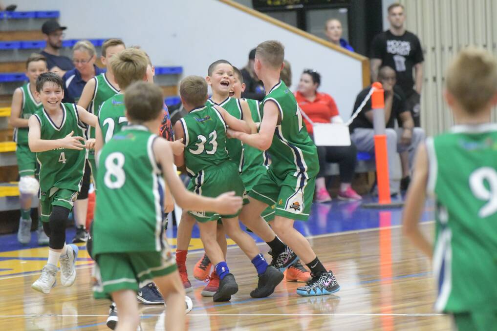 THAT WINNING FEELING: Warrnambool Seahawks players are all smiles after winning the Basketball Victoria Country under 12 grand final on Sunday. Picture: Bendigo Advertiser
