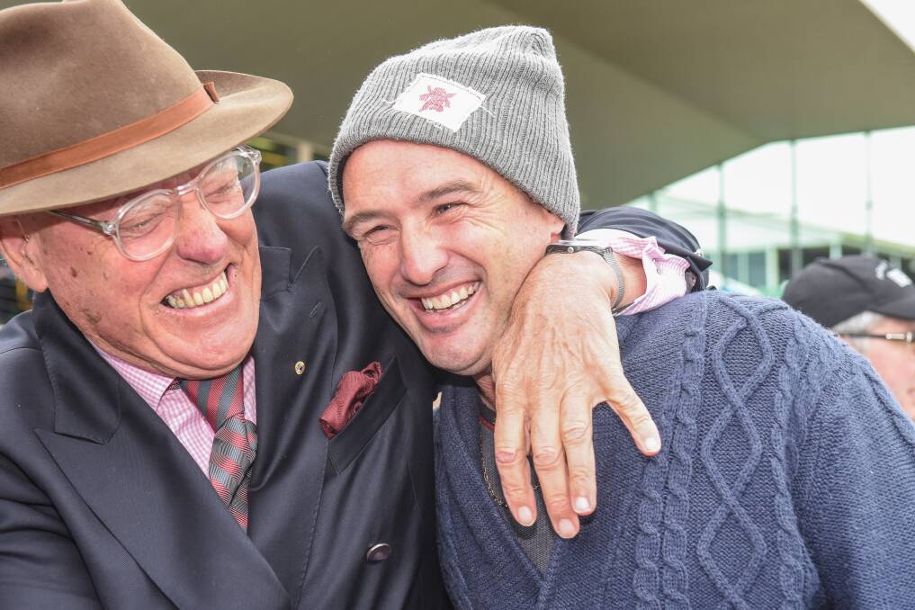 CHUFFED: Racing enthusiast Bob Charley with trainer Nathan Dunn, who celebrated his first May Racing Carnival win in race two on Tuesday. Picture: Todd Nicholson/Getty Images 