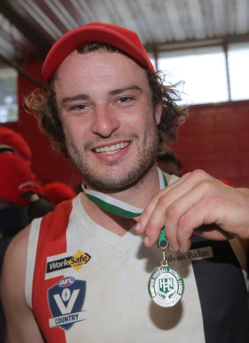 AT LAST: Jayden Whitehead with his first premiership medal.