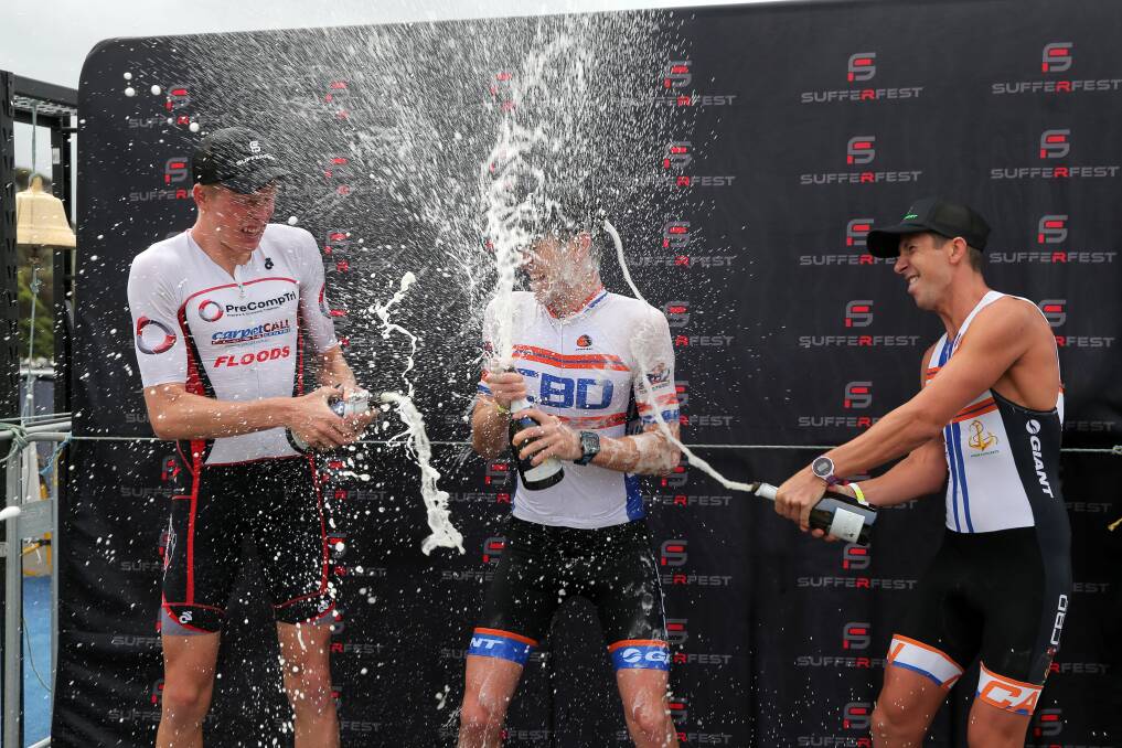 CHAMPAGNE CELEBRATION: Geelong triathlete Levi Maxwell (right) is hoping to stand on the Sufferfest podium again on Sunday. Picture: Rob Gunstone