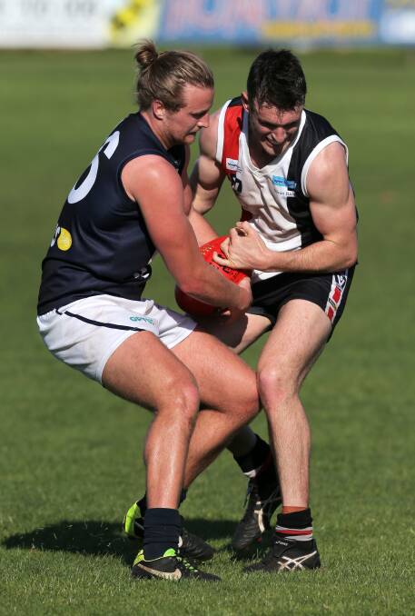 DUEL: Defender Will Jacobs was instrumental for Warrnambool early, but key forward Sam Dobson was a match winner for Koroit after half-time. Picture: Rob Gunstone