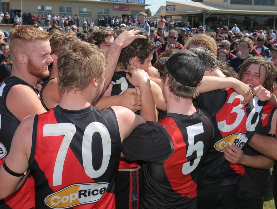 DONE IT: Cobden footballers celebrate after the siren confirmed their under 18.5 flag. The Bombers kicked the last four goals of the match. Picture: Vicky Hughson