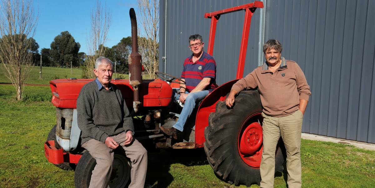 A BETTER LIFE: Allansford resident and Rotarian Graeme Ross (left) donated a tractor to help rebuild a Papua New Guinea village. He is pictured with fellow Rotarians Ian Watson (centre) and Tony Austin (right). Picture: Rob Gunstone