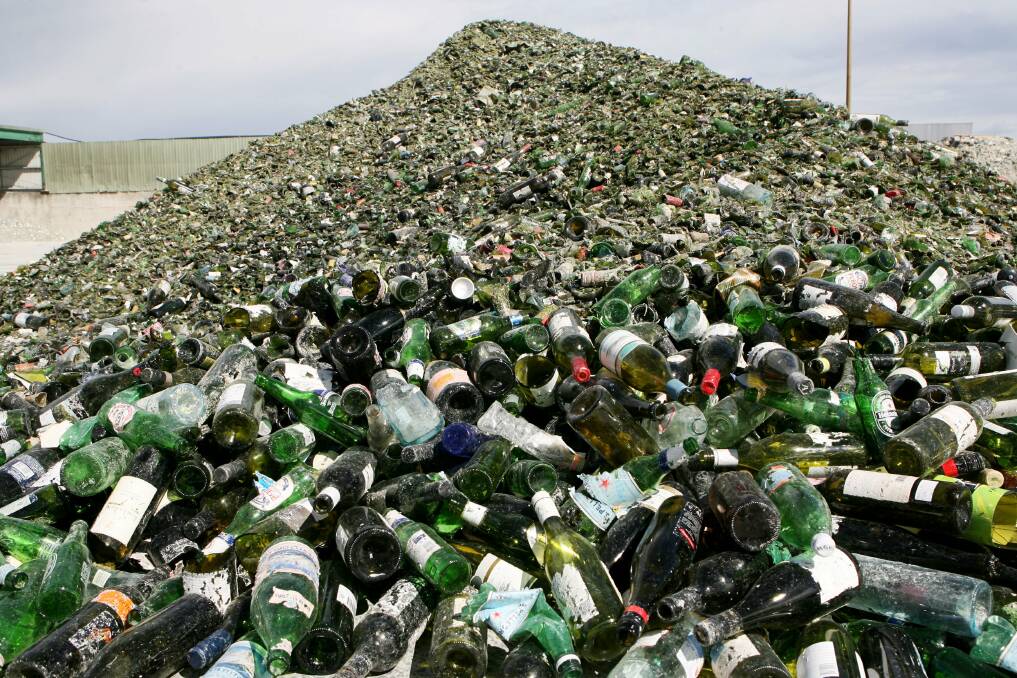 Wine bottles and other glass bottles on their way to being recycled.