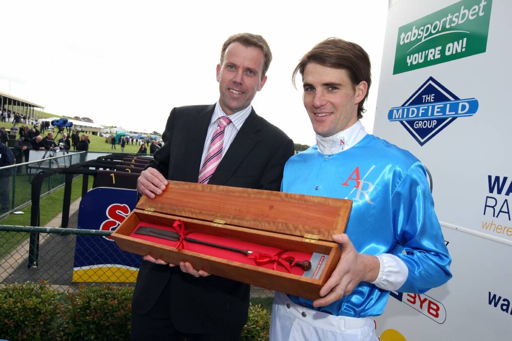 Supporter: Wannon MP Dan Tehan (left), who presents a commemorative whip to a winning jumps jockey at Warrnambool's May Racing Carnival each year, backs the state plan. Here he is pictured with star jockey Steven Pateman.