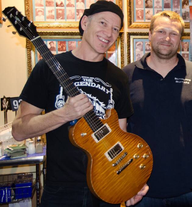 THE HUMAN COMETH: Jimi Hocking, pictured with Port Fairy luthier Justin Sutcliffe and the guitar that Sutcliffe made for Hocking, is back in Warrnambool this weekend.