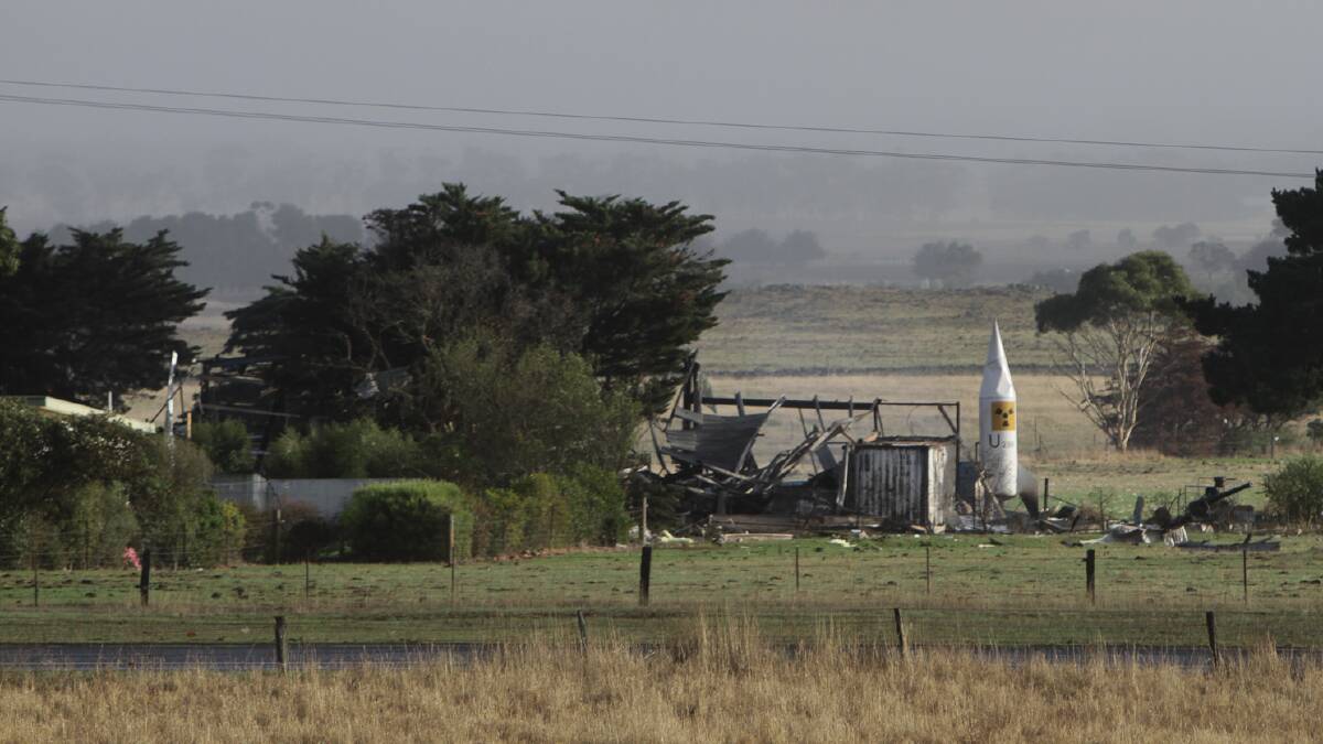 A tank dressed up like a rocket remains standing on the Sanders' property after the blast.