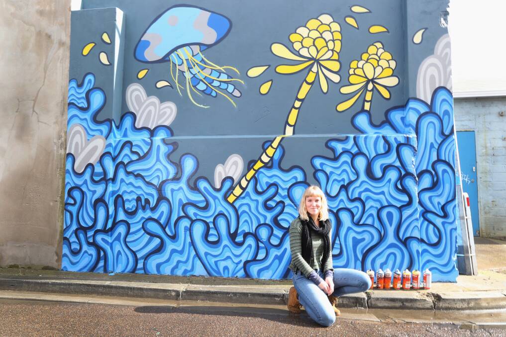 Guided tours of Warrnambool's street art are happening this week. Pictured is Warrnambool artist Jessicah Meggs with her Patloch Lane mural. Picture: Amy Paton