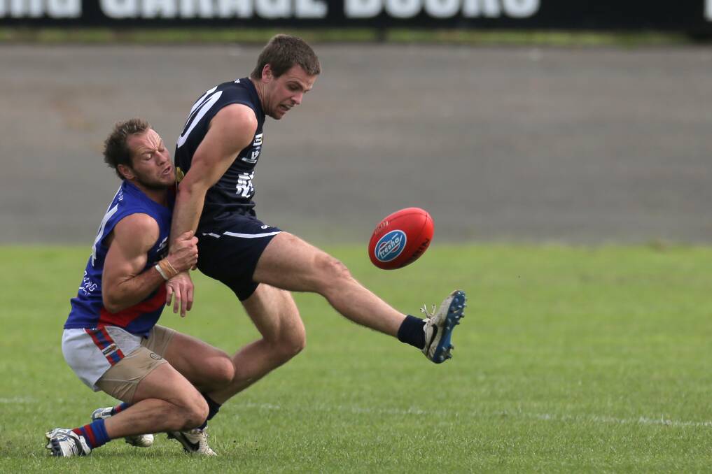 POWER UP: Former Terang Mortlake on-baller Joel Moloney, pictured laying a tackle on Brendan Moore in the 2015 Hampden preliminary final, has joined Kolora-Noorat.