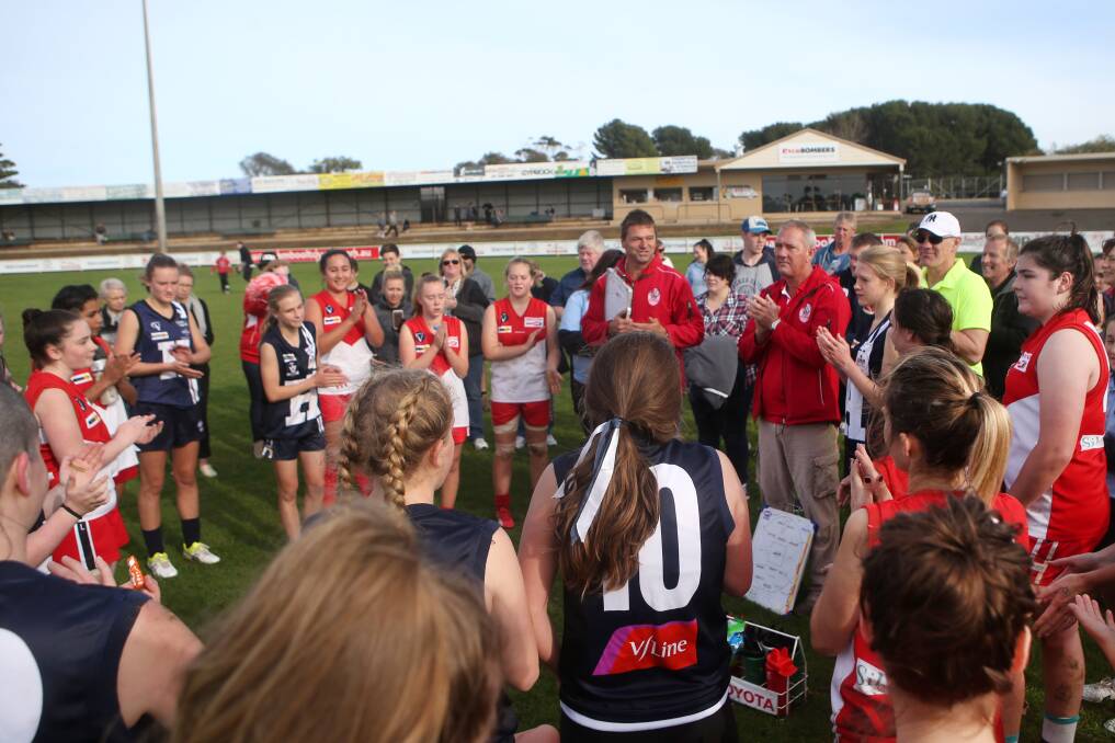 SUCCESS: Coaches Daryl Fary and Michael Crutchfield congratulate all the players after last year's South Warrnambool women's exhibition match, which was a curtain-raiser Hampden's senior men's interleague match. Picture: Amy Paton .