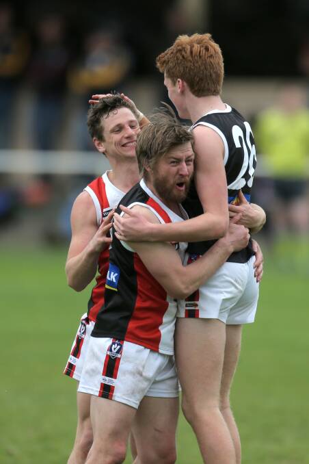 JOY: Koroit's Ben Goodall celebrates with teammates during last year's grand final win. He will return for his third game of 2017 on Saturday.