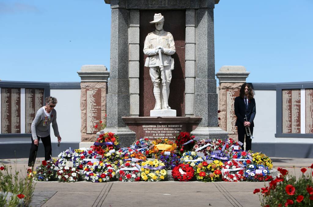People lay wreaths at the Remembrance Day service in Warrnambool last year. Picture: Rob Gunstone