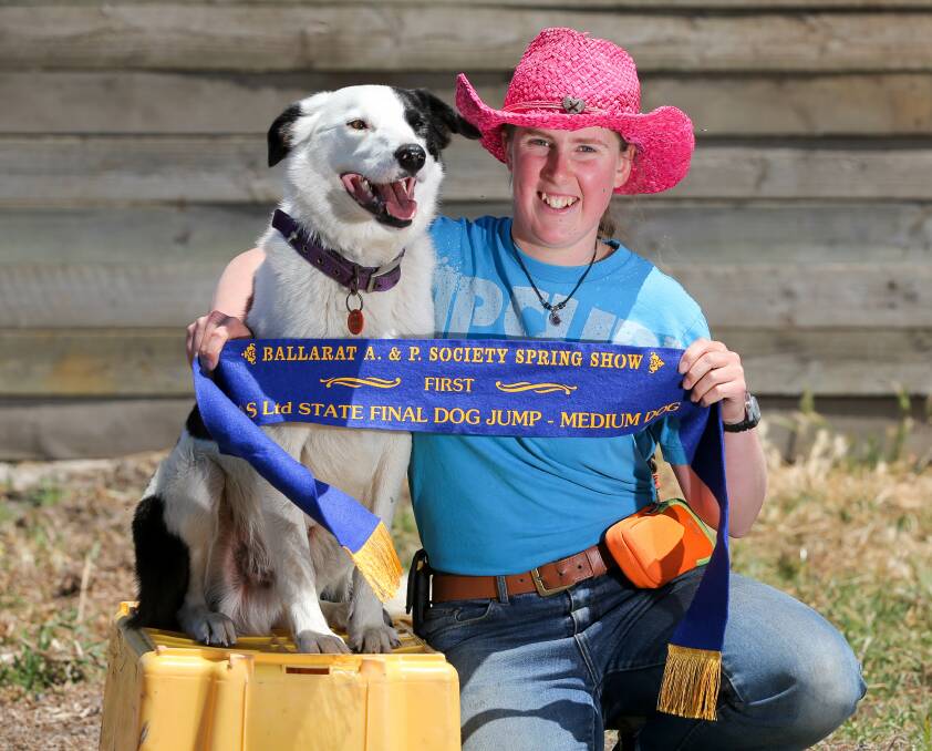 Award winner: 2016 Victorian dog high jump champion 'Saveloy' would jump anything, according to his doting owner, 19 year-old Tiah Drake, of Childers Cove. Picture: Rob Gunstone