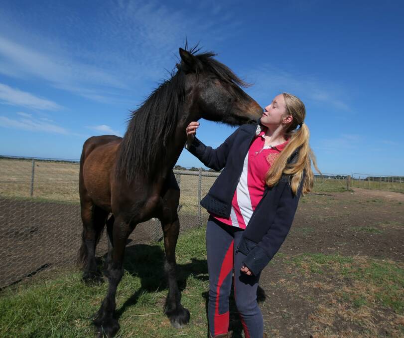 IT'S GOOD TO BE BACK: Maisy shows how happy she is to be back home in St Helens as she gives her owner Molly Hocking a big kiss. Picture: Rob Gunstone