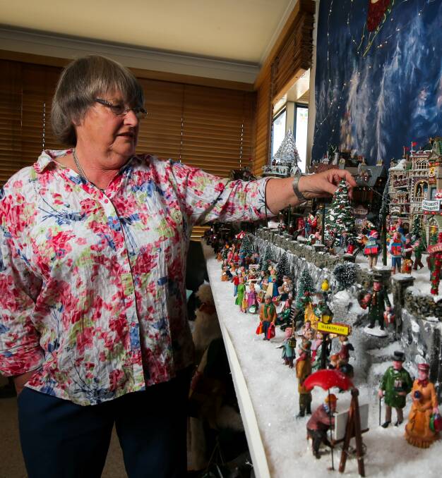 IN THE SPIRIT: Port Fairy's Ann Holmes checks out her Christmas village which will be opened up to the public this Sunday. Mrs Holmes has been adding to the village over the past 15 years. Picture: Rob Gunstone