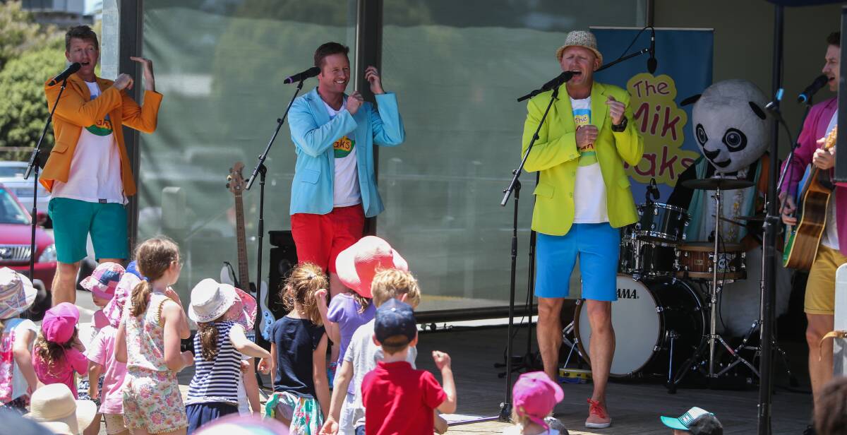 COLURFUL: The Mik Maks entertain children and parents with their singing and dancing on the Fiddler's Green in Port Fairy during the Moyneyana Festival. 