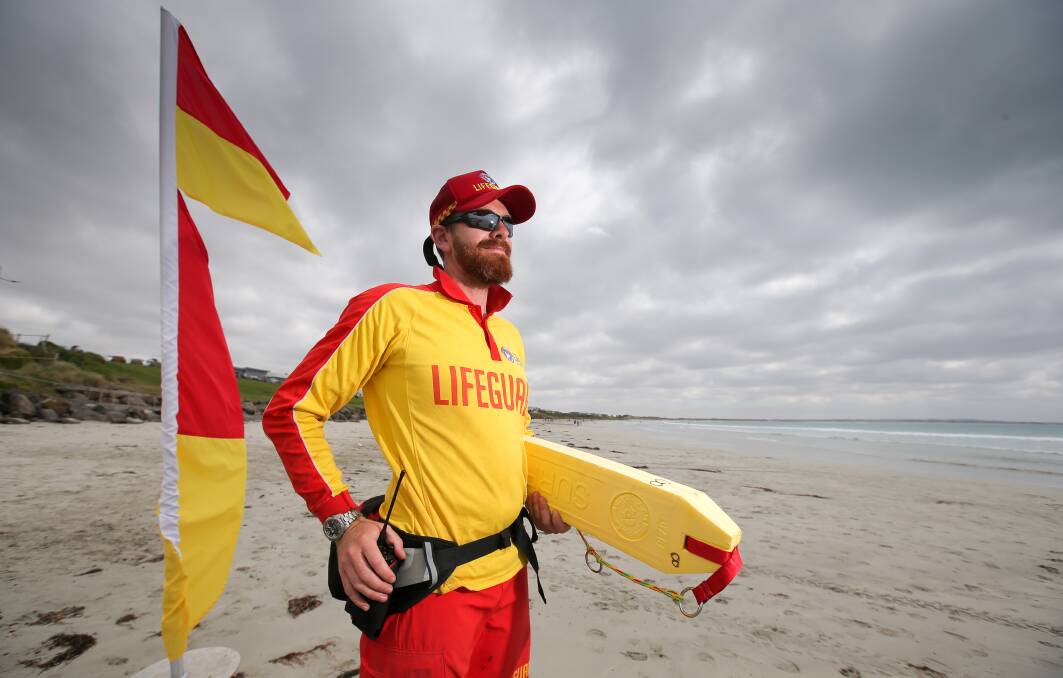 CLOSED: On-duty surf lifesaver Tony Webb and his colleague closed East Beach in Port Fairy on Monday after a fisherman reported a possible shark sighting. Picture: Rob Gunstone