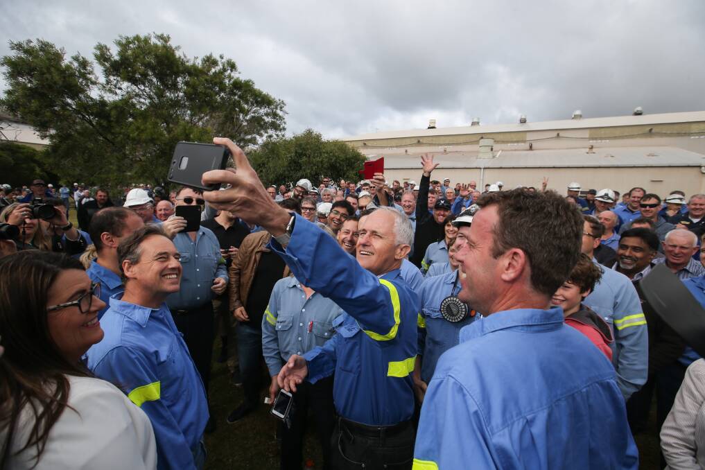 Happy snap: Prime Minister Malcolm Turnbull takes a selfie with a smelter worker after an announcement last Friday. Picture: Amy Paton