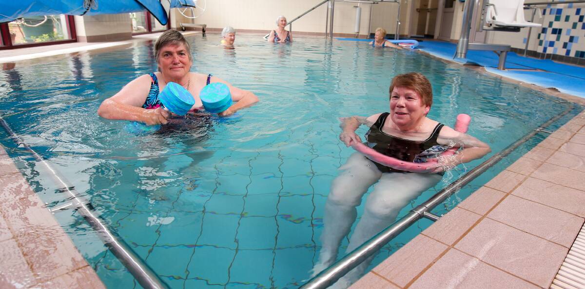 Splash: Archie Graham Community Centre hydrotherapy pool users Jess Groves and Shirley McDonald are happy to be back. Picture: Rob Gunstone