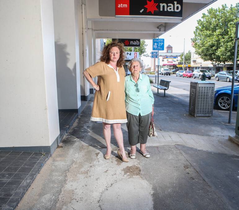 ROUGH: Warrnambool City Council mayor Cr Kylie Gaston and Warrnambool resident Joan Dunning are unimpressed with the Koroit Street footpath. Picture: Amy Paton