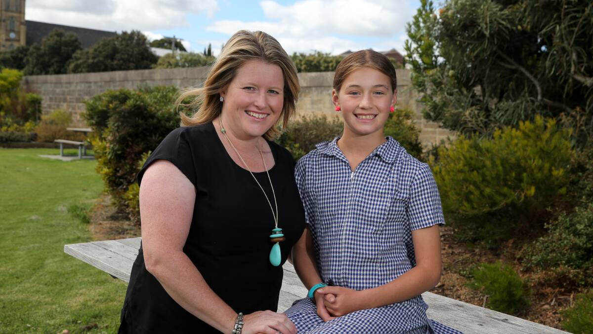 FRIENDS: Ellerslie's Kristen Pickford has received a $70 donation from Hannah Dyson from St Helen's towards her fundraising for the Melanoma March campaign. Picture: Rob Gunstone