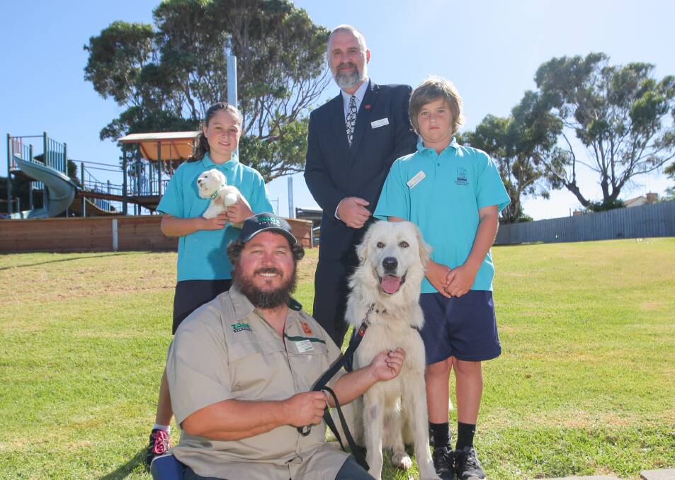 Growing: Warrnambool West Primary School'a Alenna Wytkamp, guardian dog project co-ordinator Dave Williams with Albus, principal Phil Barnes and Joseph Douglas are helping to save the eastern barred bandicoot. Picture: Morgan Hancock
