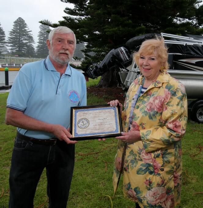 Grateful: Port Fairy Marine Rescue Service president Russell Lemke thanks Rosemary Arnold who donated a boat and trailer to the group. Picture: Rob Gunstone