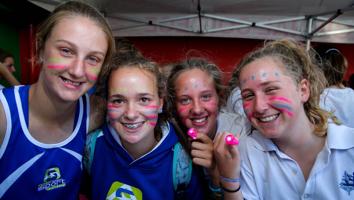 Colourful characters: Local netballers Laura Coffey, 15, Katelyn Grant, 15, Molly Evans, 14, and Isabella Rowe, 14, got into the spirit of the Netfit Netball Neon event. Picture: Rob Gunstone