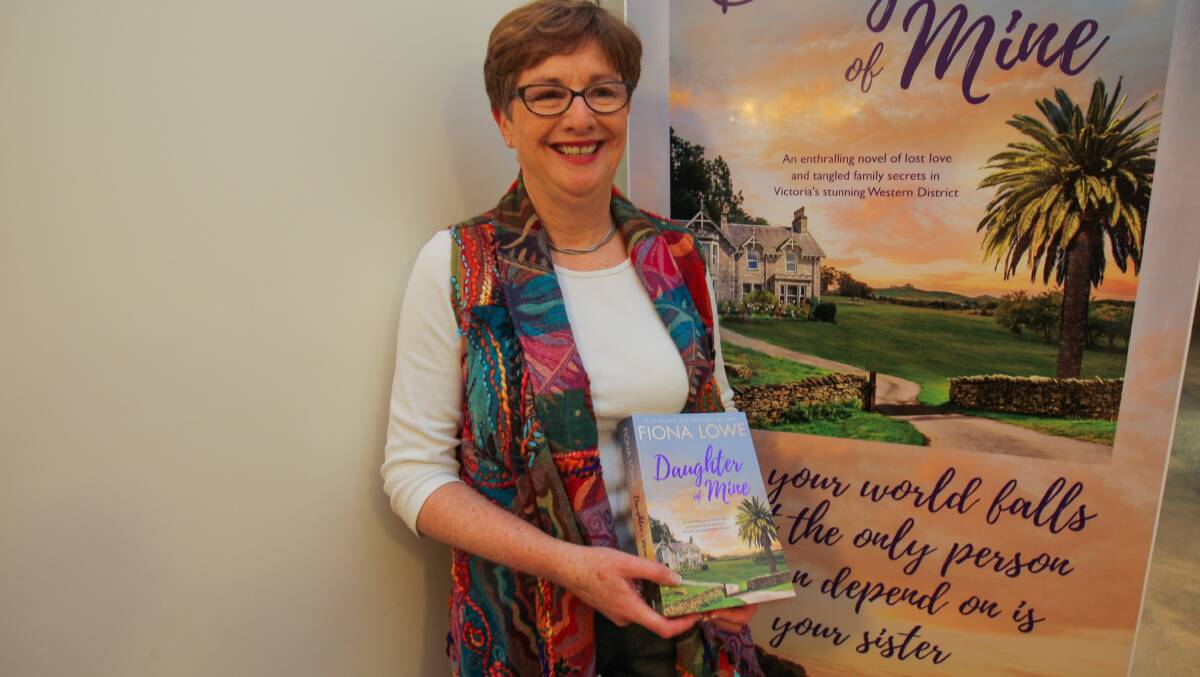 On tour: Author Fiona Lowe holding her new book, Daughter of Mine, which she talked about at a session at Warrnambool's Brightbird Espresso. Picture: Morgan Hancock
