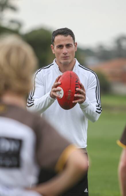 LEARNING FROM THE BEST: Two-time Collingwood best and fairest Paul Licuria takes Hawks junior training on Tuesday night at Allan Oval. Picture: Amy Paton