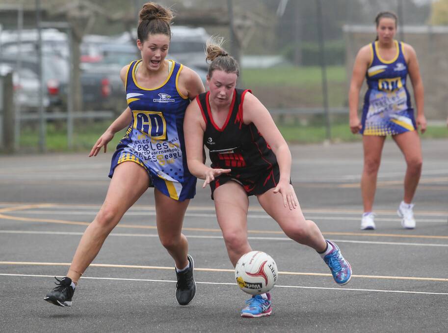 TOUGH BATTLE AHEAD: North Warrnambool Eagles goal defence Molly McKinnon and Cobden wing attack Sophie Blain compete for the ball. Their teams both have important clashes for top-five standings on Saturday.