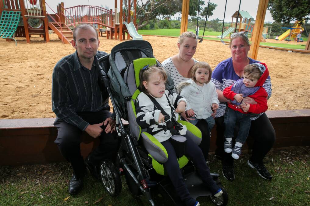 Mission: Craig Haberfield, with daughter Grace, 8, Annmaree Freeman, with daughter Deliliah, 16 months, and Corrina Hayhoe, with son Marshall, 2, are calling for council to invest in an all-abilities playground. Picture: Rob Gunstone