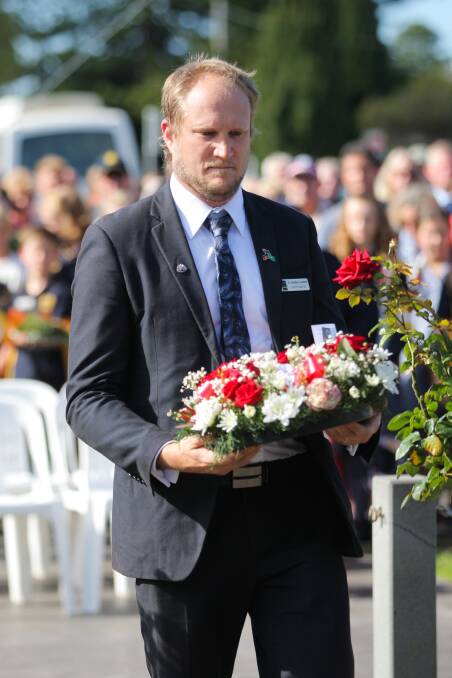 Cr Jordan Lockett, pictured laying a wreath at the Port Fairy Anzac Day service, has introduced an acknowledgement of country at Moyne Shire meetings and events. Picture: Morgan Hancock