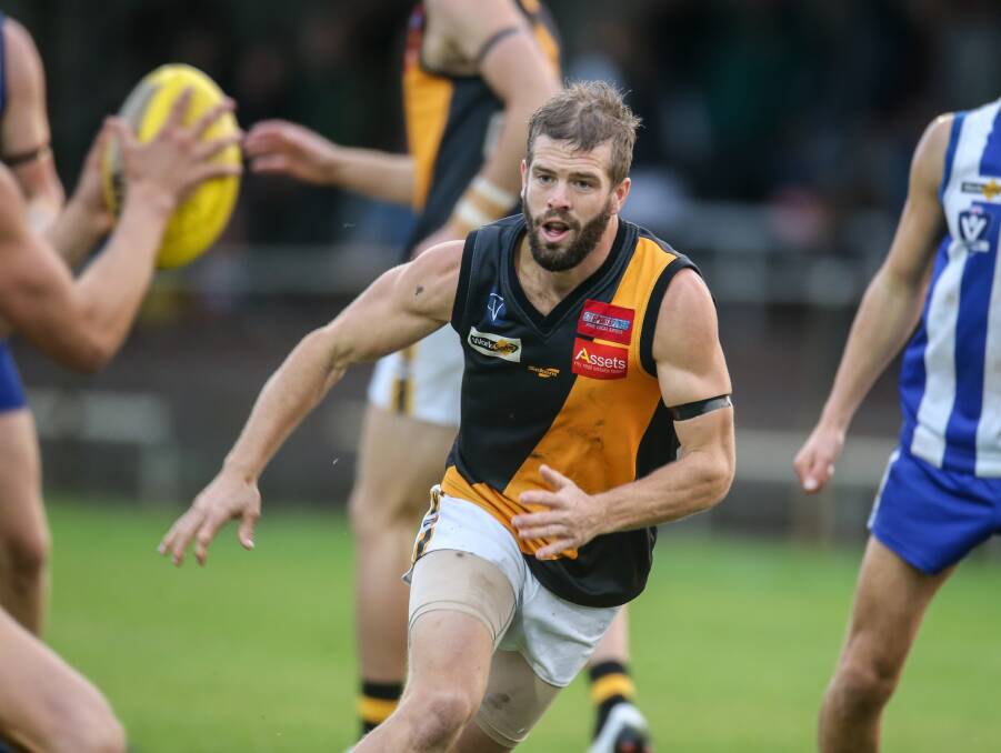 On the hunt: Portland playmaker Rhys Egan has eyes only for the ball during Tuesday night's clash with Hamilton Kangaroos at Melville Oval. Picture: Amy Paton