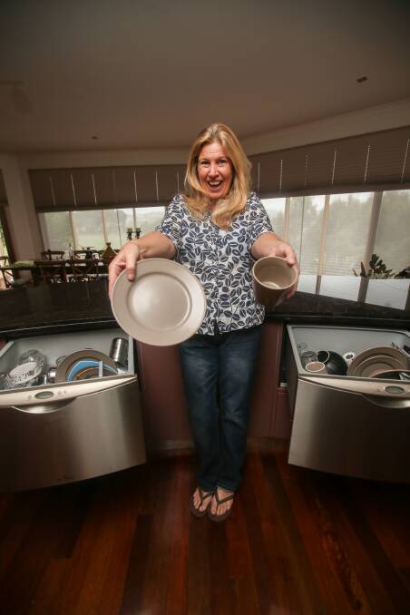 ALL SMILES: Warrnambool's Suzanne Fergeus is very happy to have two dishwashers and believes she saves time and money. Picture: Amy Paton