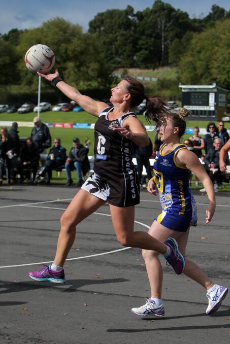 REACH: Camperdown centre Tracey Baker takes the ball ahead of North Warrnambool Eagles centre Kate O'Meara.