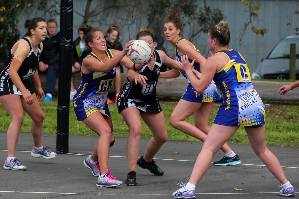 TIGHT CONTEST: North Warrnambool Eagles goal attack Skye Billings receives a hot pass in the circle at Leura Oval.