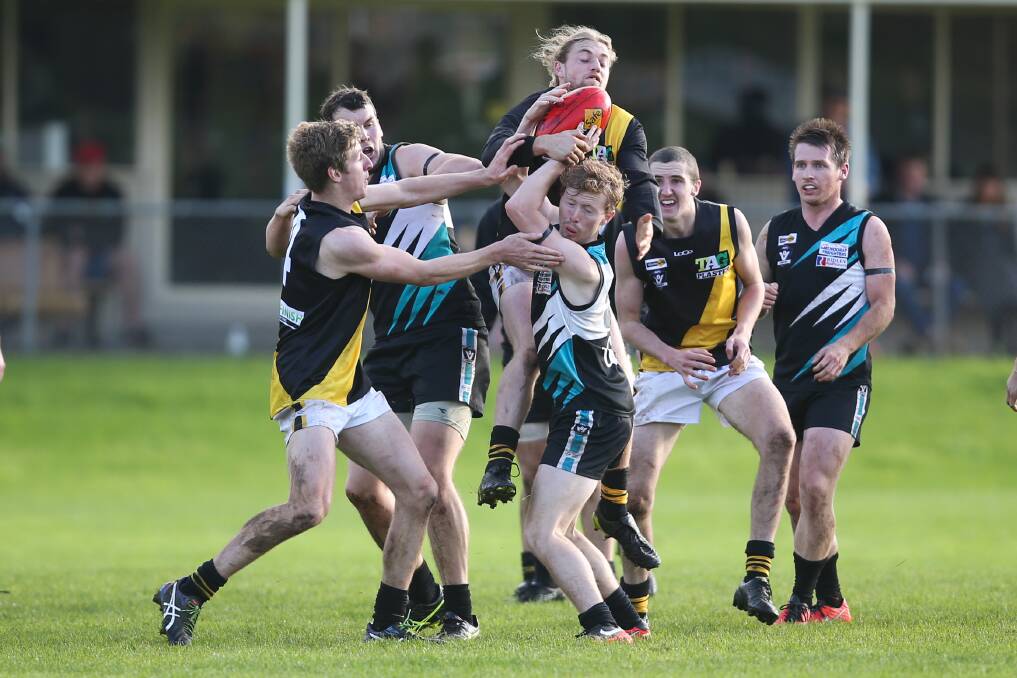 MARKERS UP: Merrivale's Xavier Beks jumps over Kolora-Noorat's Sandy Williams to take a contested mark. Picture: Morgan Hancock