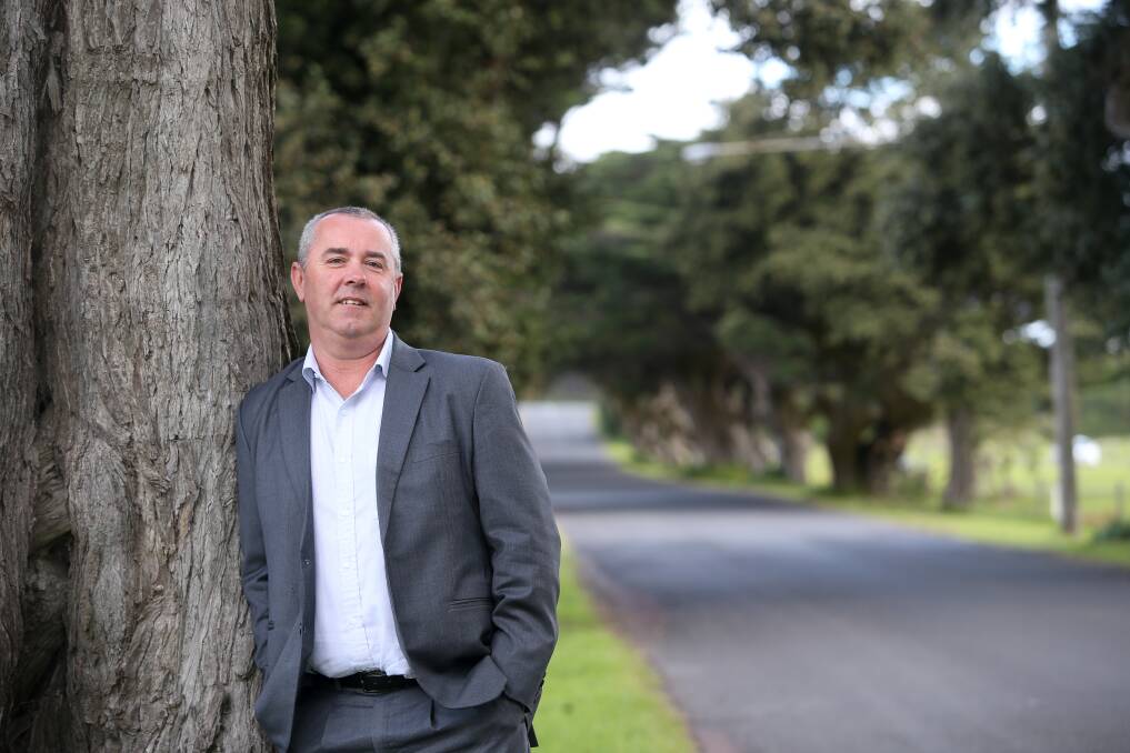 Moyne Shire director of physical services Trev Greenberger with the aging cypress trees on James Street removed because they posed a safety risk. Picture: Amy Paton