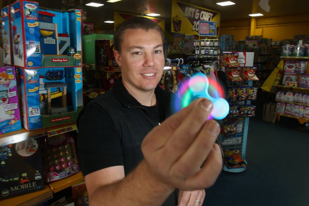 Spun out: Toyworld's Tarryn Jephcott with one of the fidget spinners that has taken Warrnambool by storm. Picture: Morgan Hancock
