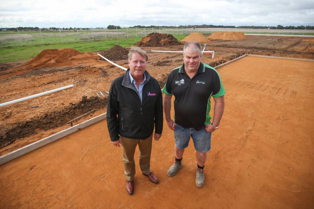 UNDER CONSTRUCTION: Selling agent Peter Herbert and South West Sheds and Homes director Mick Macklyn at Gateway Business Park. Picture: Morgan Hancock