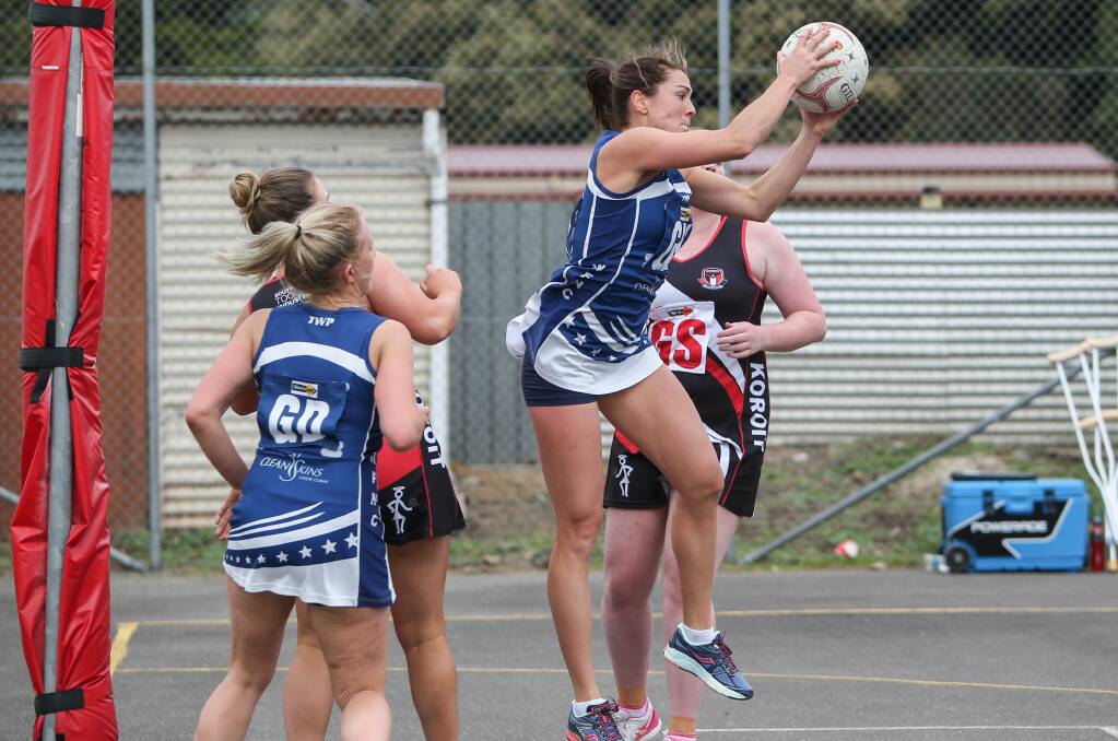 UP FOR THE CHALLENGE: Warrnambool goal keeper Emma Cust takes a mid-air intercept to help her team out of a difficult position.